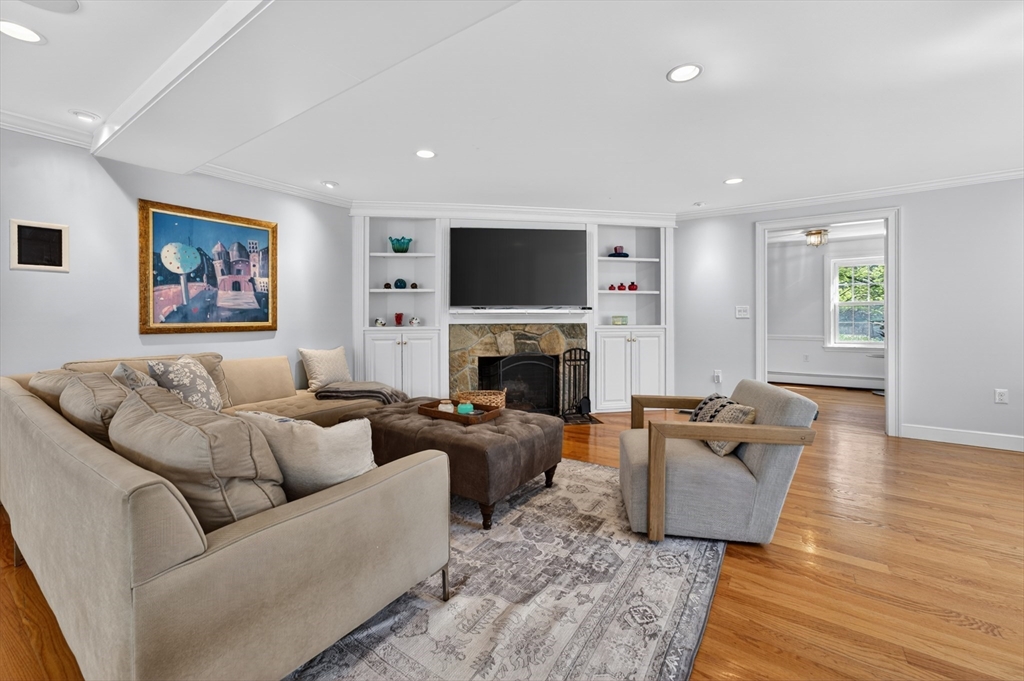 71 Robert Best Road Sudbury, MA 01776 - Photo 6 of 31 a living room with furniture fireplace and flat screen tv