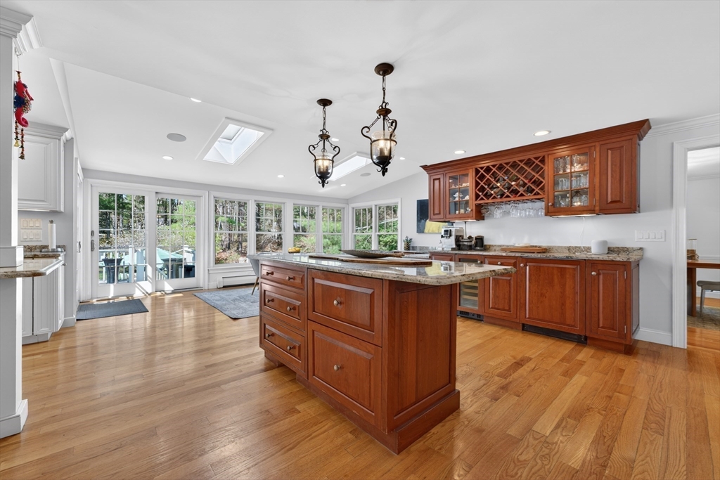 71 Robert Best Road Sudbury, MA 01776 - Photo 7 of 31 a living room with granite countertop kitchen island furniture and a wooden floor