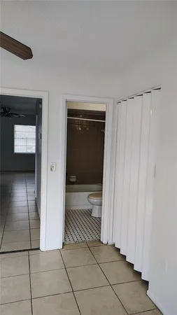 a kitchen with a refrigerator and a sink