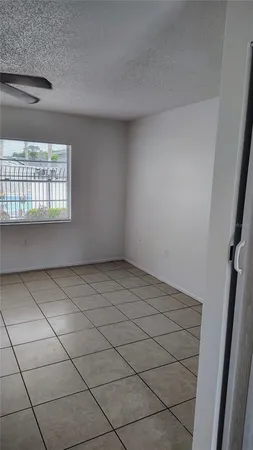 a view of a backyard with plants and lake view