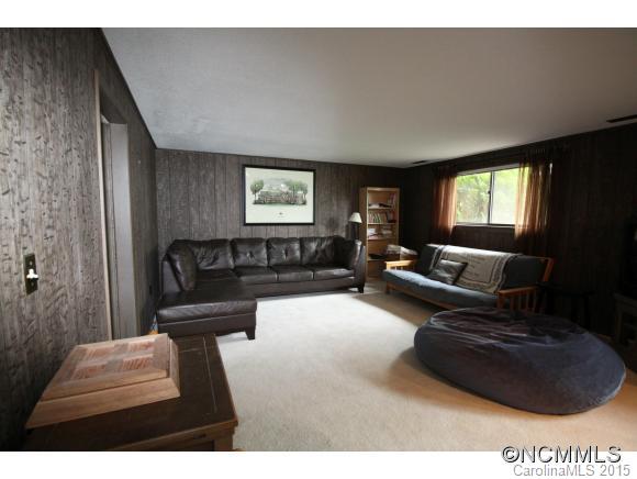 1201 New Market Road Tryon, NC 28782 - Photo 15 of 19 a living room with furniture and a flat screen tv