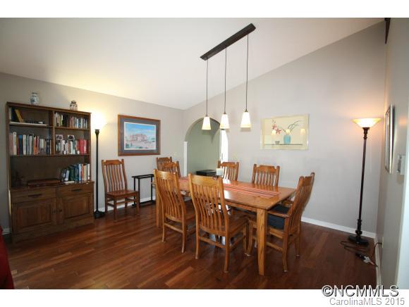 1201 New Market Road Tryon, NC 28782 - Photo 8 of 19 a view of a dining room with furniture and wooden floor