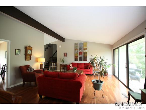 1201 New Market Road Tryon, NC 28782 - Photo 9 of 19 a living room with furniture a large window and a flat screen tv