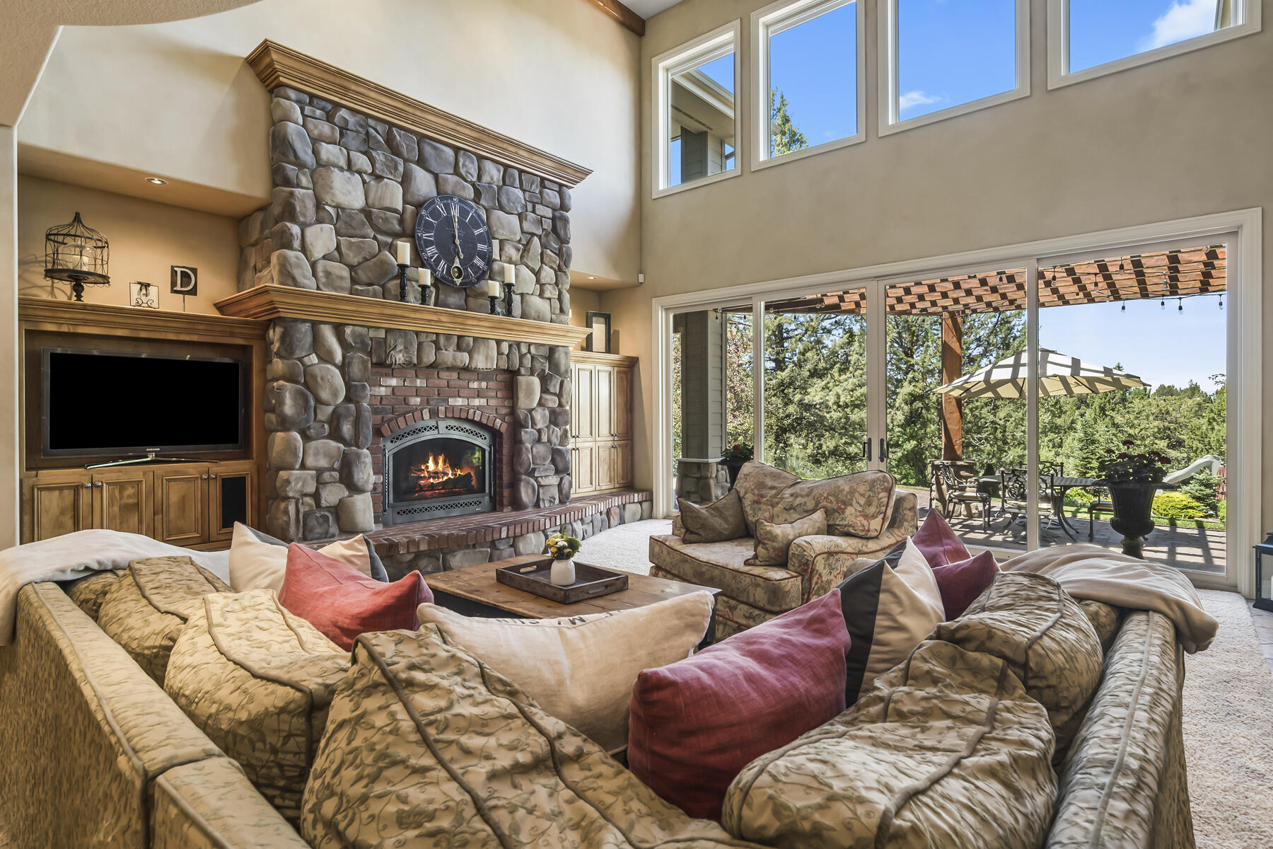61445 Gosney Road Bend, OR 97702 - Photo 35 of 83 a living room with furniture a fireplace and a flat screen tv