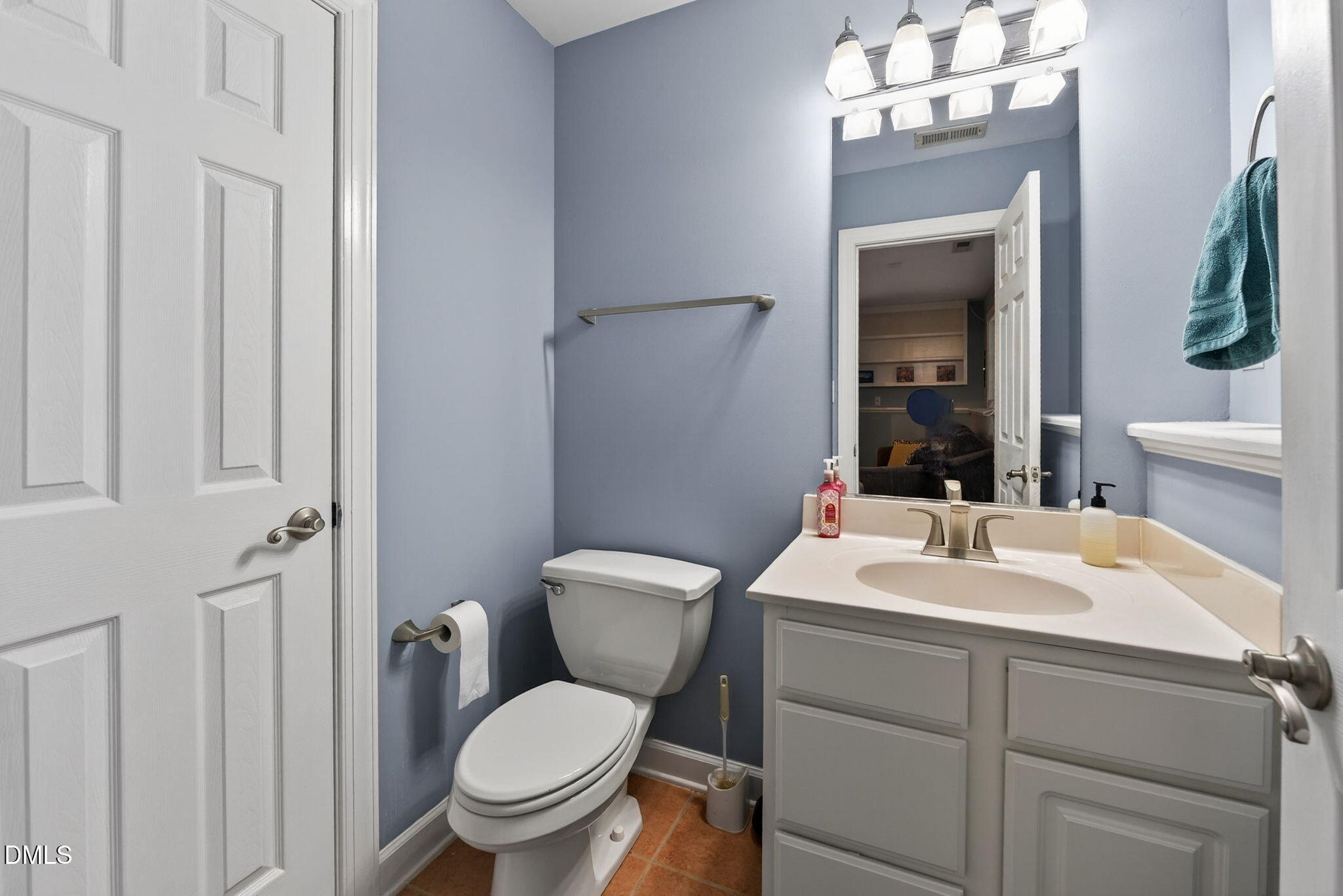 5500 Vista View Court Raleigh, NC 27612 - Photo 17 of 38 a bathroom with a toilet sink and mirror