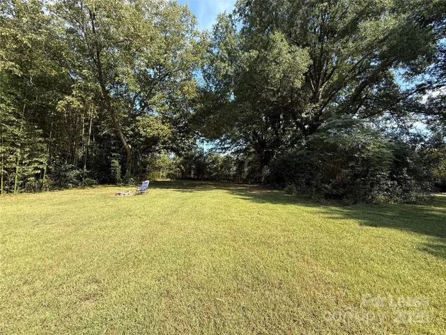 a view of a swimming pool and an outdoor space