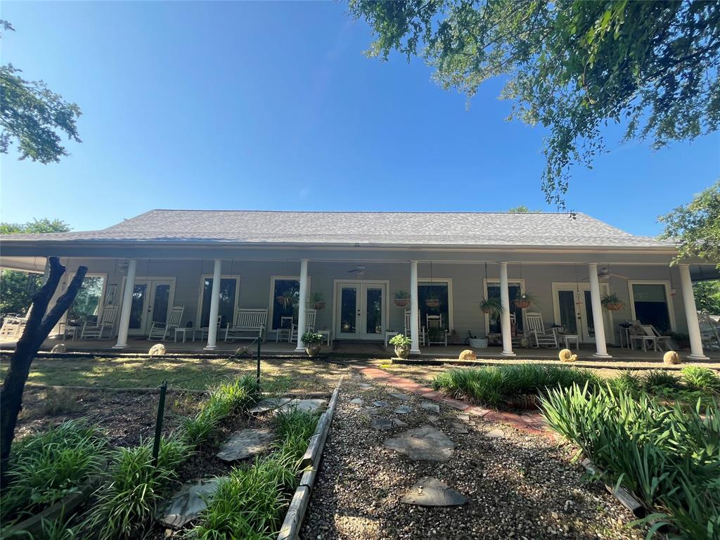 3220 Randell Lake Road Denison, TX 75020 - Photo 16 of 19 a view of a house with a swimming pool and porch with furniture