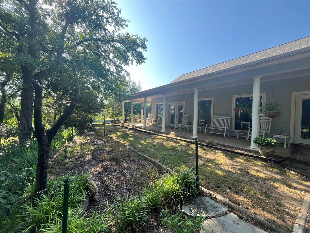 3220 Randell Lake Road Denison, TX 75020 - Photo 17 of 19 a view of a house with backyard and sitting area
