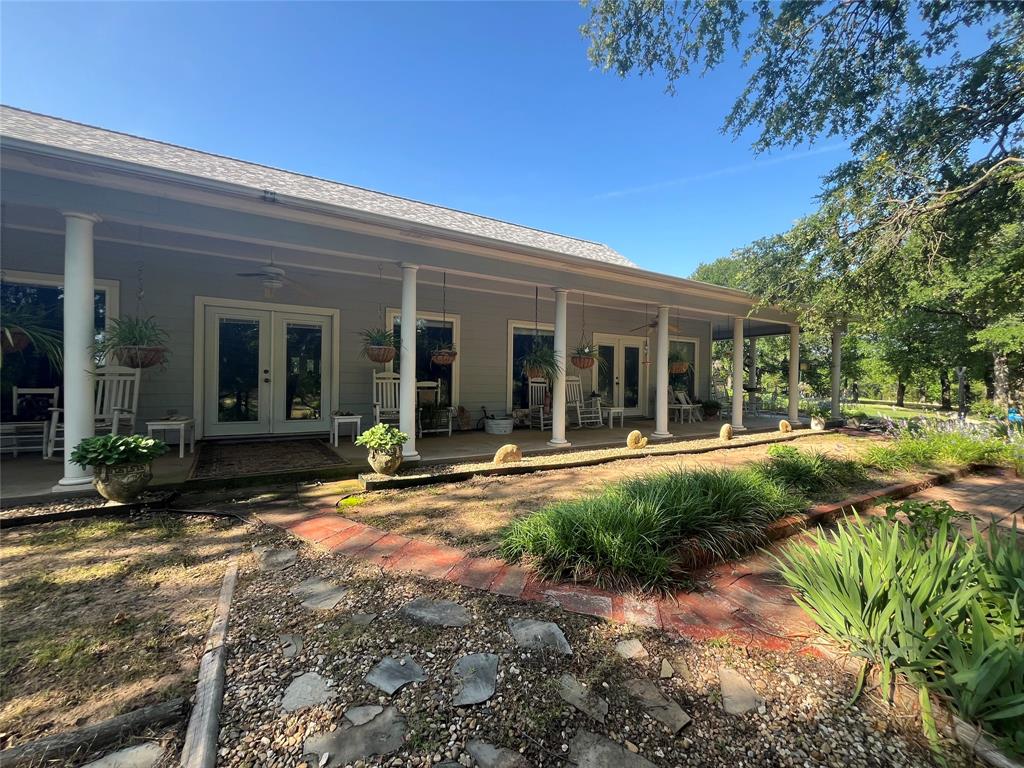 3220 Randell Lake Road Denison, TX 75020 - Photo 18 of 19 a view of a house with backyard sitting area and porch