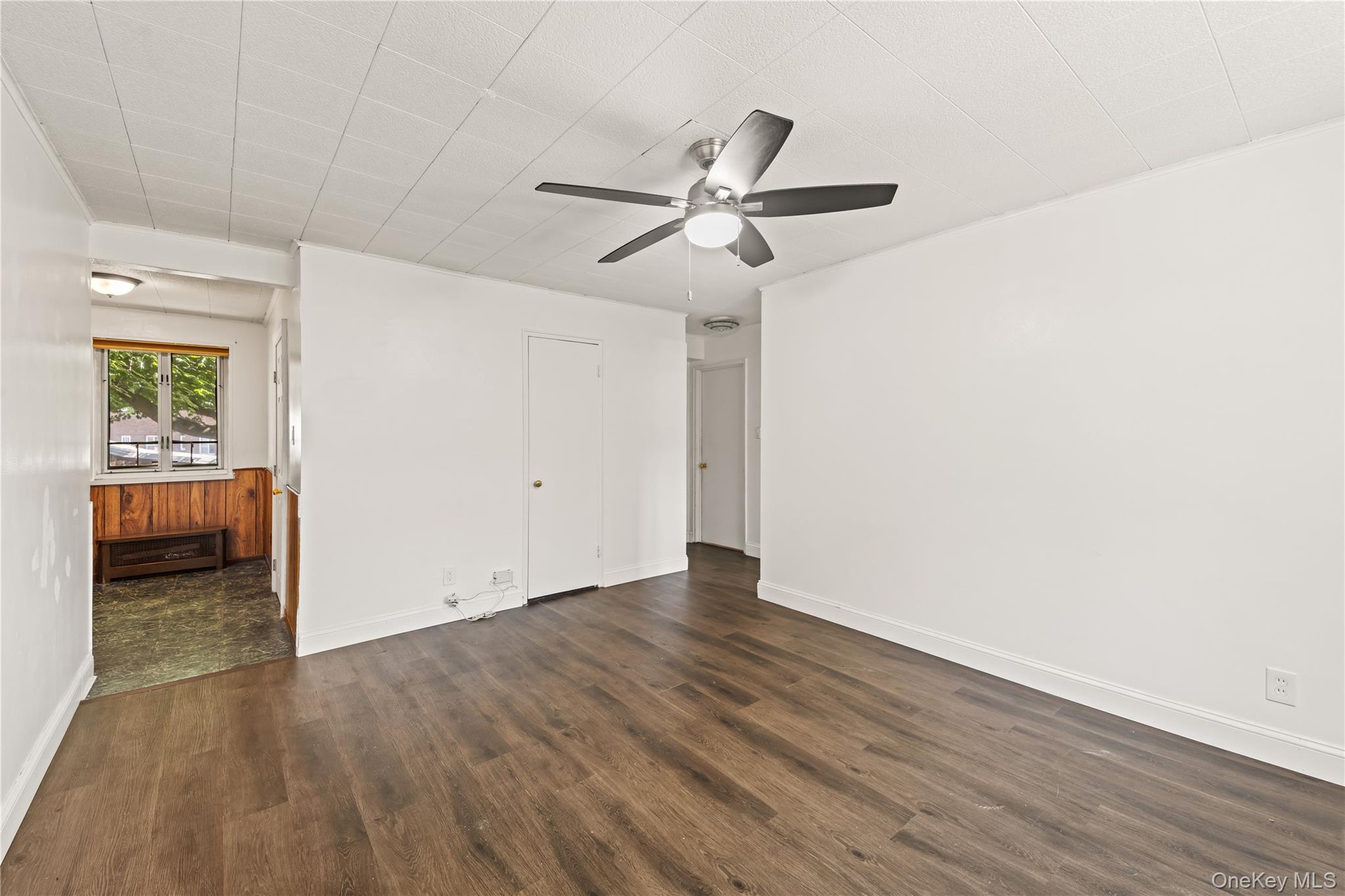 225-35 88th Avenue, Unit LOWR Queens, NY 11427 - Photo 3 of 15 a view of empty room with wooden floor