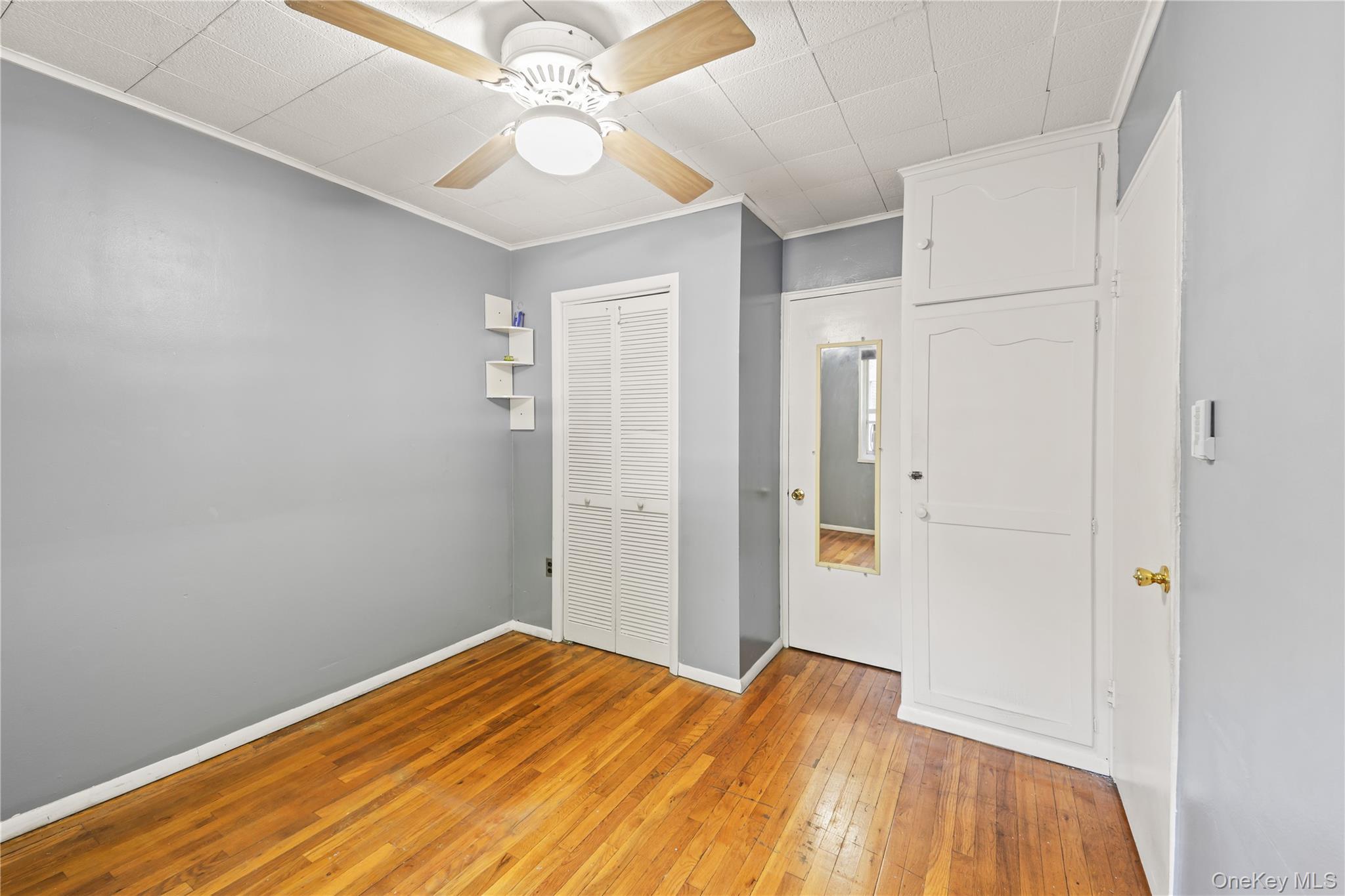225-35 88th Avenue, Unit LOWR Queens, NY 11427 - Photo 7 of 15 a view of empty room with wooden floor