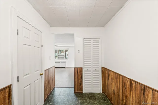 a view of washer and dryer with kitchen in the background