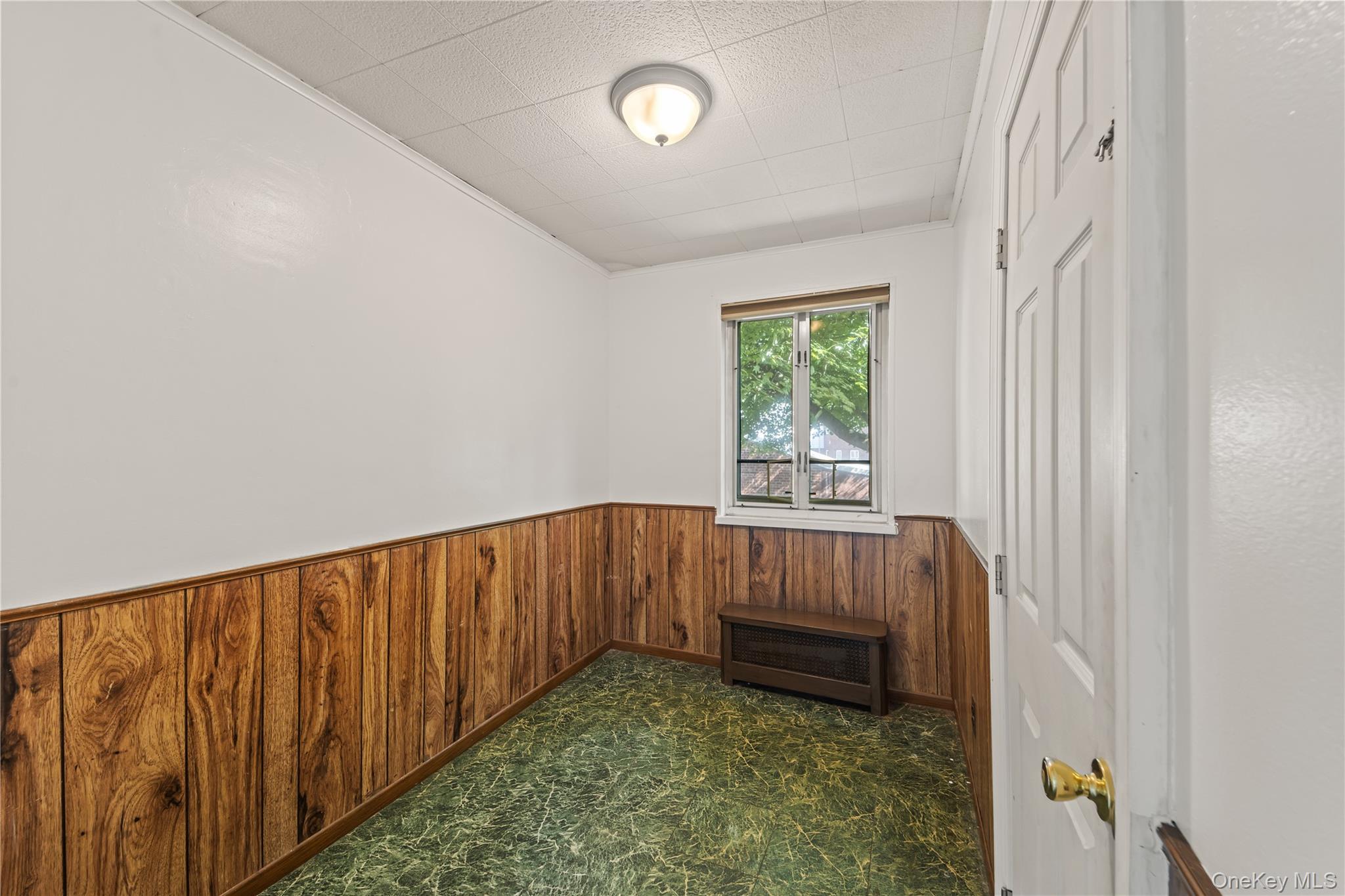 225-35 88th Avenue, Unit LOWR Queens, NY 11427 - Photo 9 of 15 a view of room with stairs and a window