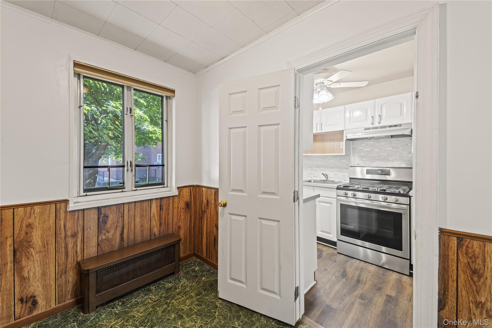 225-35 88th Avenue, Unit LOWR Queens, NY 11427 - Photo 10 of 15 a view of washer and dryer with kitchen in the background