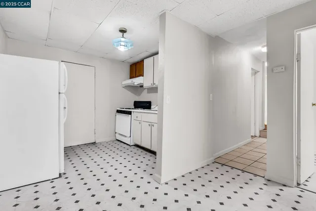a kitchen with stainless steel appliances a stove a sink and cabinets
