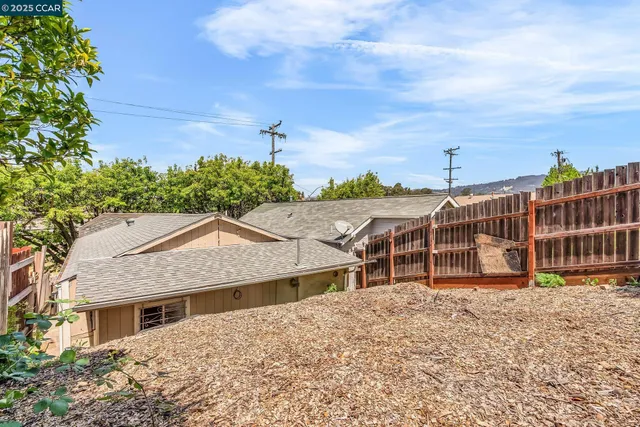 a house with trees in the background