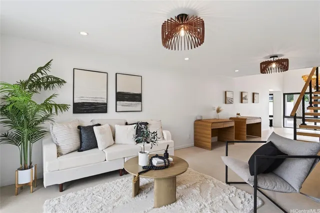 a living room with furniture and a painting