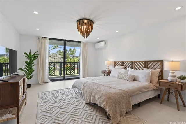 a bedroom with a large bed and a large window