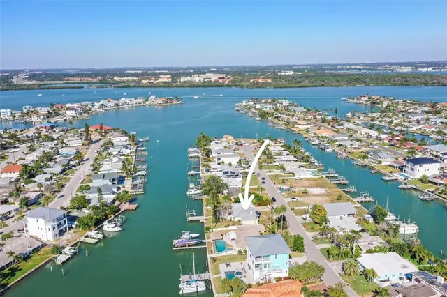an aerial view of a city with ocean view