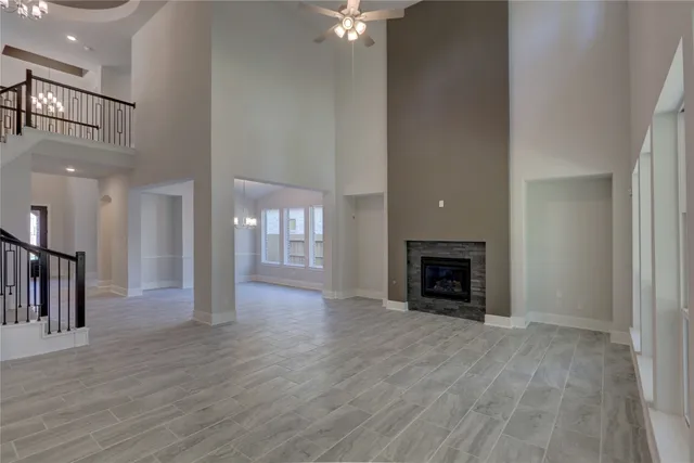 a view of a livingroom with a fireplace and window