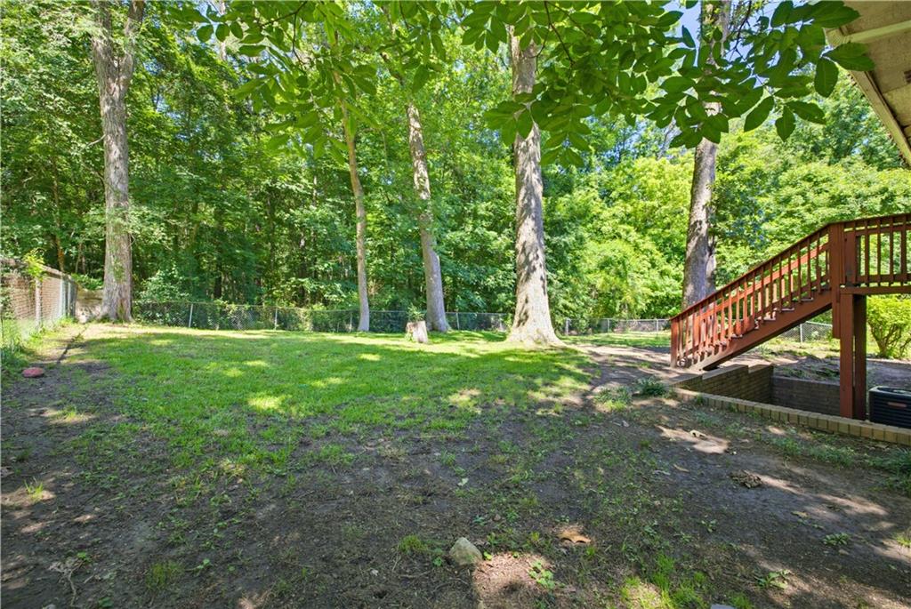 4188 Cedar Valley Lane Conley, GA 30288 - Photo 25 of 28 a view of a yard with a tree