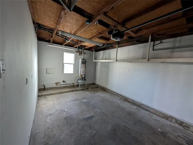 a view of a room with wooden floor and window