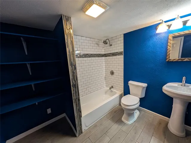 a view of a livingroom with wooden floor