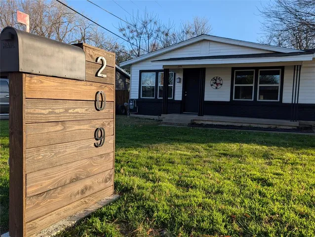 a view of a house with a large window