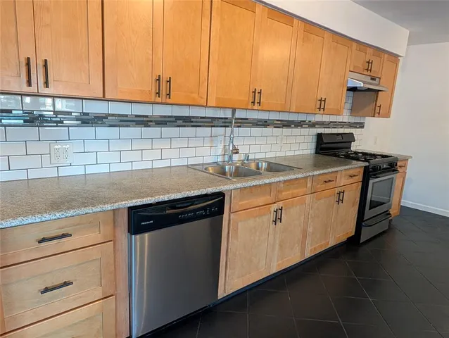 a view of a room with wooden walls