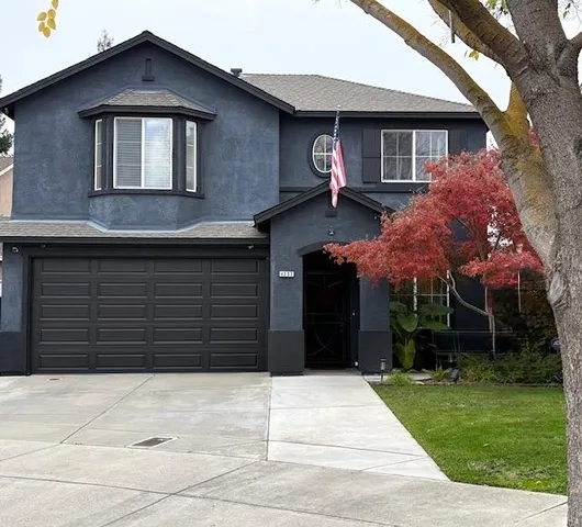 a house view with a garden space