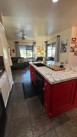 a dining room with wooden floor a glass table and chairs