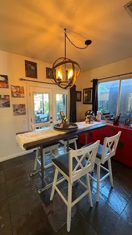 a view of living room with furniture and a large window