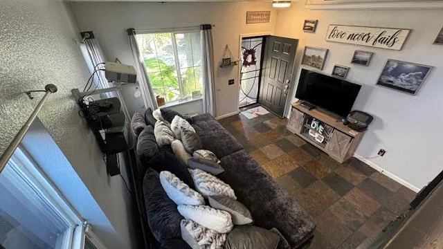 a bed sitting in a bedroom next to a window