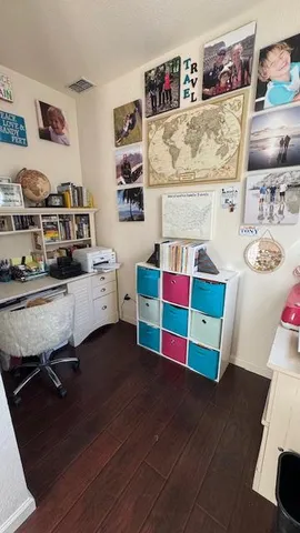 a bedroom with a bed and a view of en suite bathroom