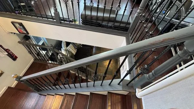a view of a room with wooden floor and window