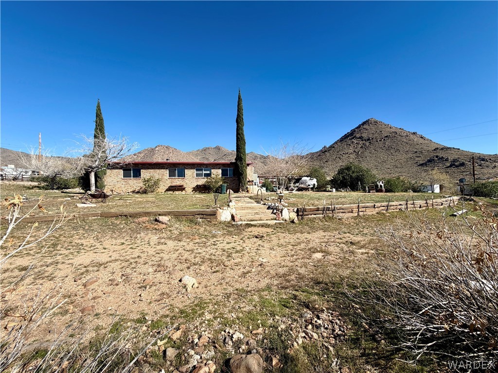 4360 Smoketree Road Golden Valley, AZ 86413 - Photo 15 of 20 a view of a house with a yard