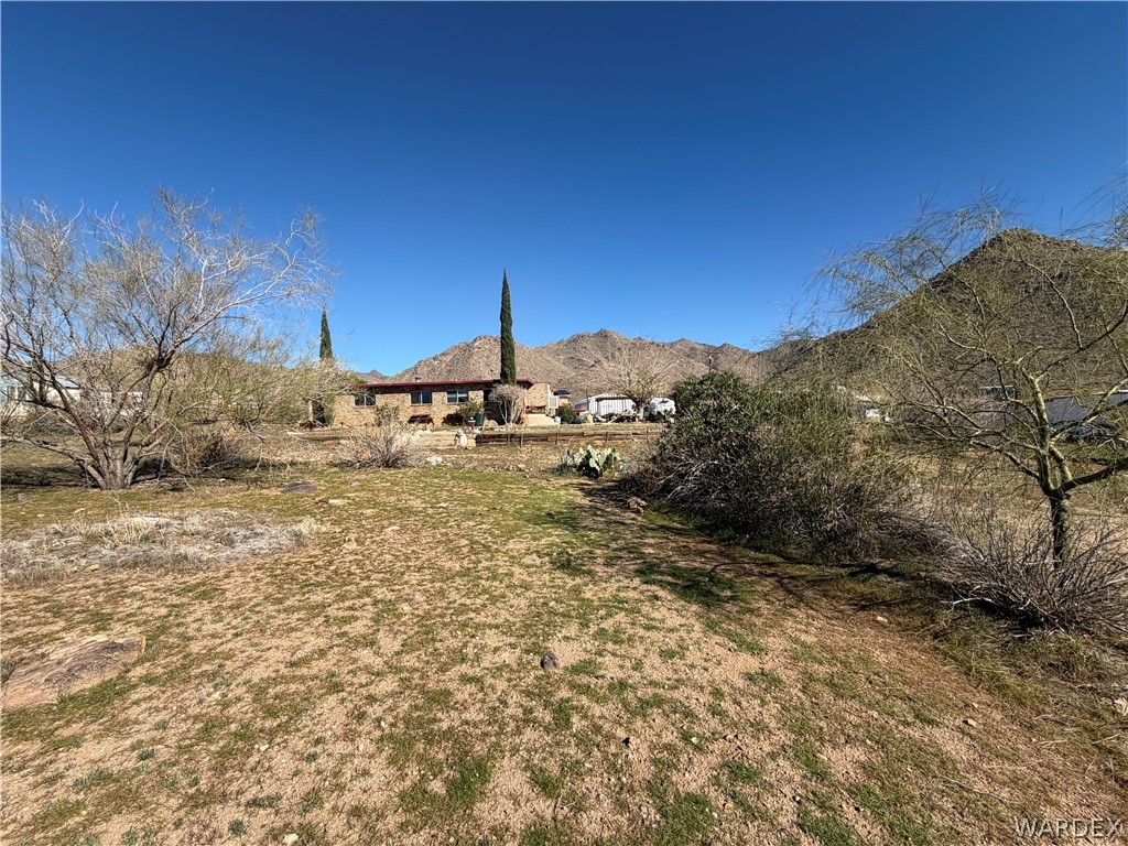 4360 Smoketree Road Golden Valley, AZ 86413 - Photo 16 of 20 a view of a yard with a house