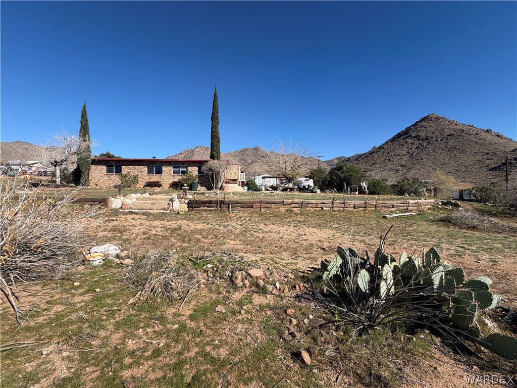4360 Smoketree Road Golden Valley, AZ 86413 - Photo 19 of 20 a view of a houses with a yard