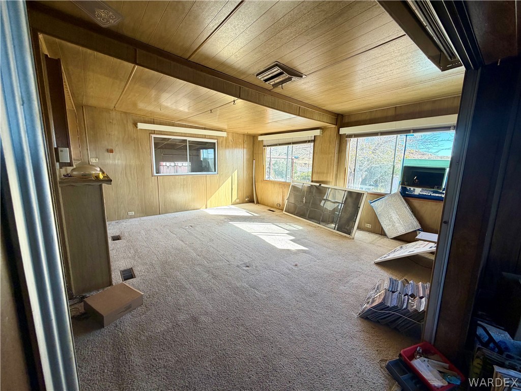 4360 Smoketree Road Golden Valley, AZ 86413 - Photo 5 of 20 a bedroom with a bed and wooden floor