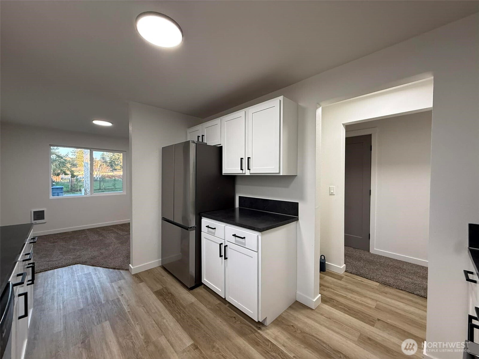 1807 Harding Road Aberdeen, WA 98520 - Photo 13 of 29 a kitchen with granite countertop a refrigerator and a stove top oven