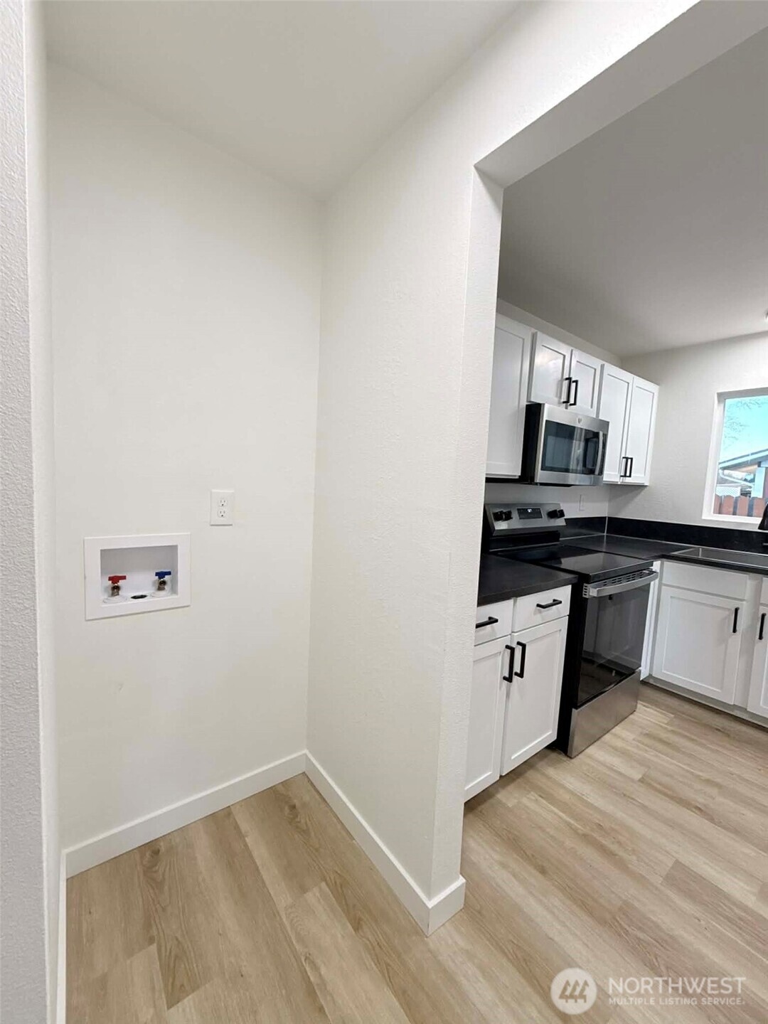 1807 Harding Road Aberdeen, WA 98520 - Photo 14 of 29 a kitchen with granite countertop a sink cabinets and stainless steel appliances