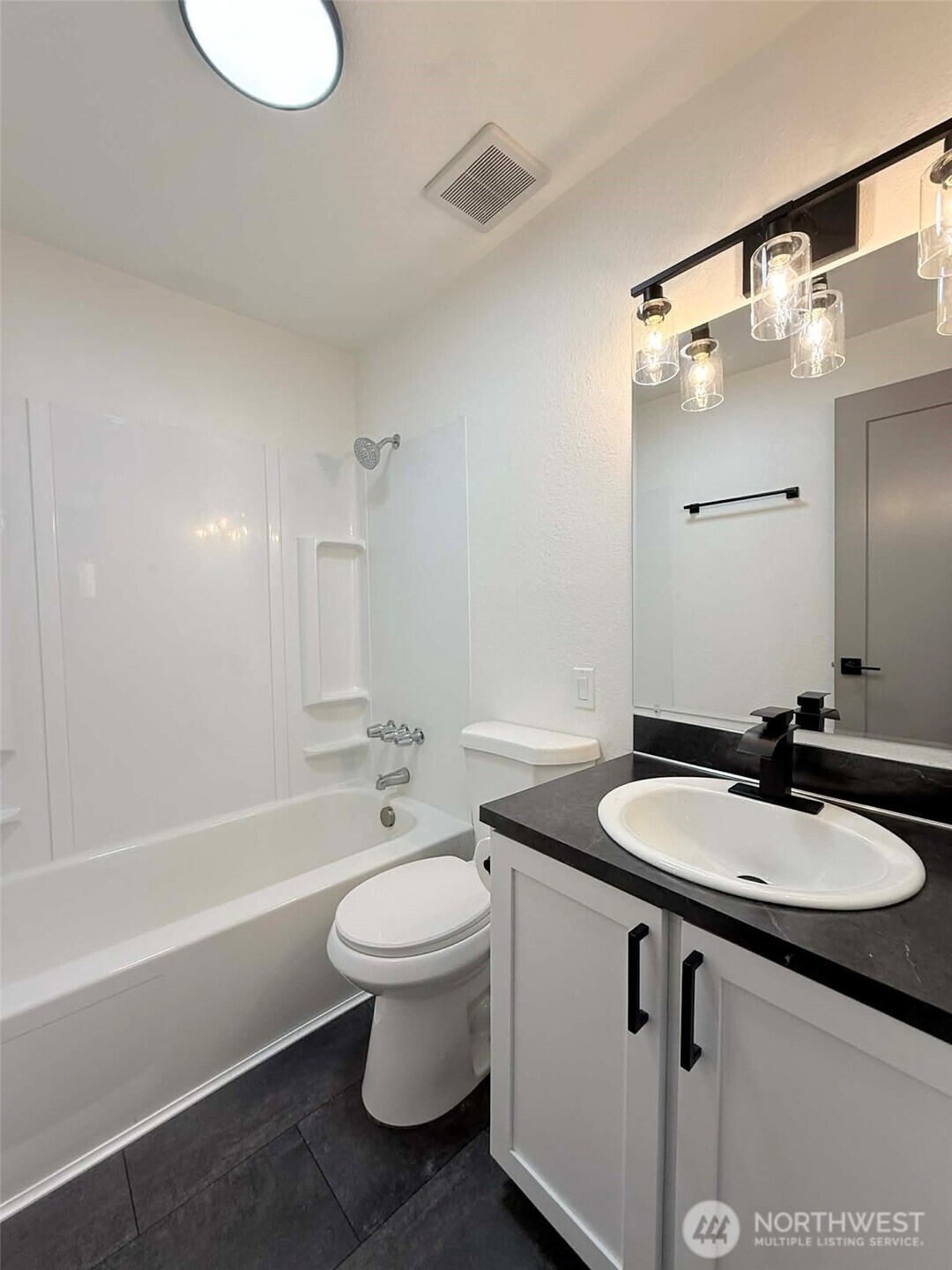 1807 Harding Road Aberdeen, WA 98520 - Photo 18 of 29 a bathroom with a sink toilet a mirror and shower