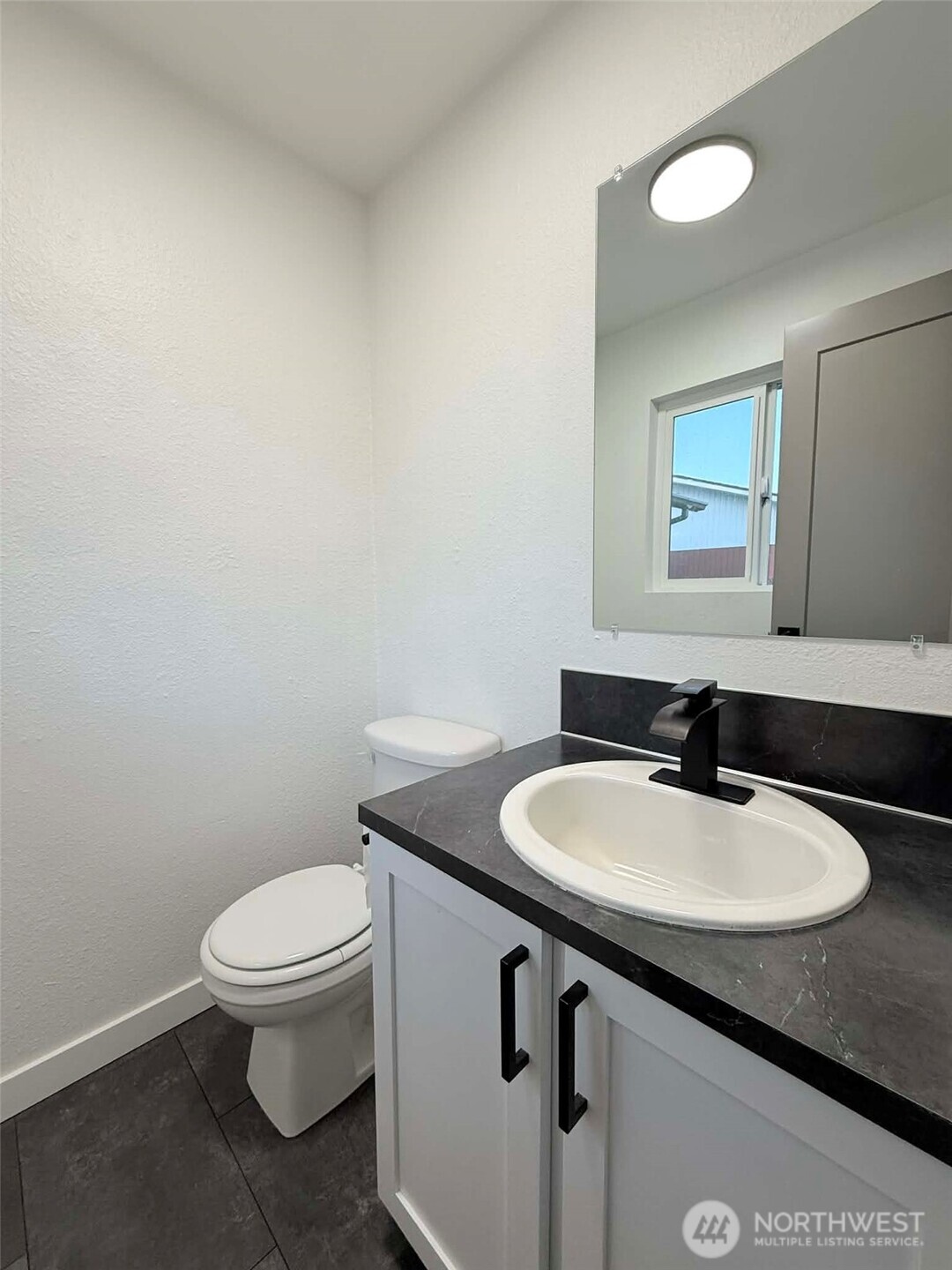 1807 Harding Road Aberdeen, WA 98520 - Photo 21 of 29 a bathroom with a sink toilet and a mirror