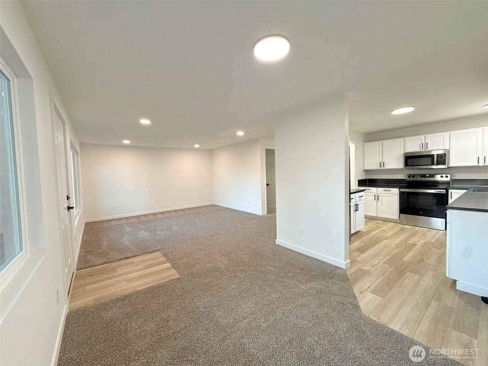 1807 Harding Road Aberdeen, WA 98520 - Photo 9 of 29 a view of kitchen with kitchen island a sink wooden floor and stainless steel appliances