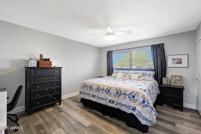 a bedroom with a bed and a dresser