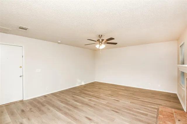 a view of a big room with wooden floor