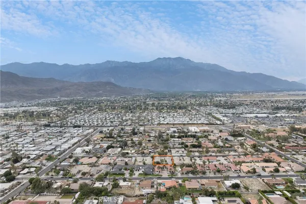 an aerial view of residential house and mountain view