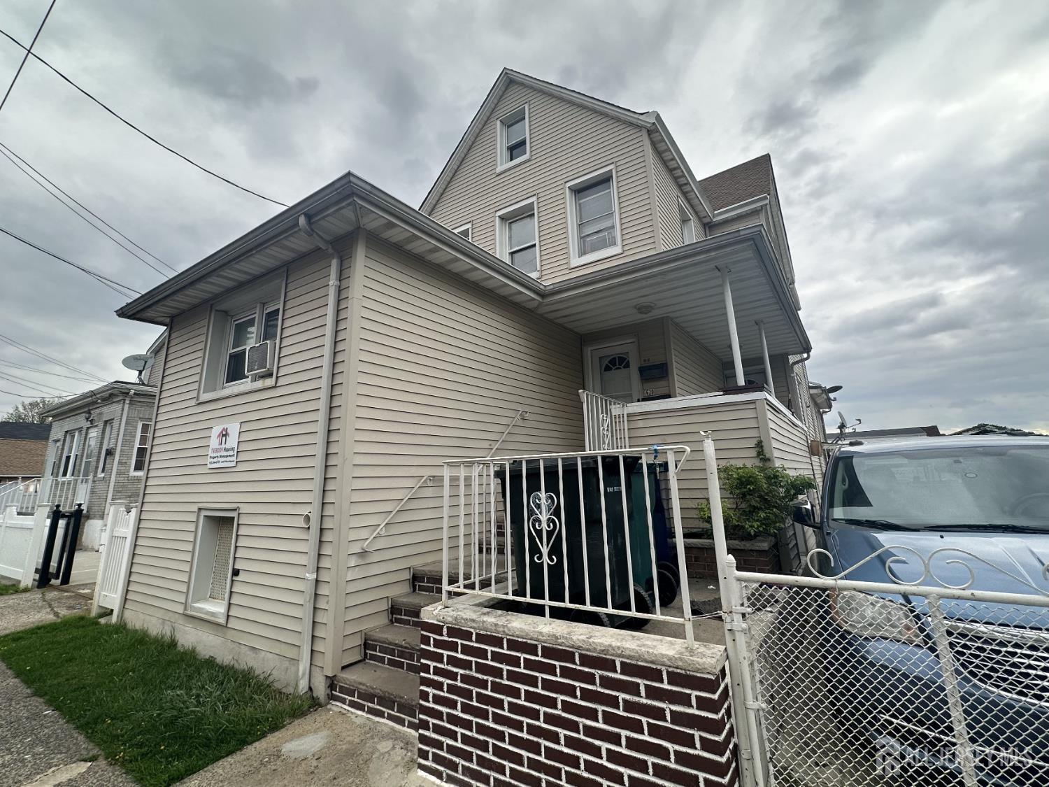 618 Carlock Avenue Perth Amboy, NJ 08861 - Photo 1 of 9 a view of a house with a small deck