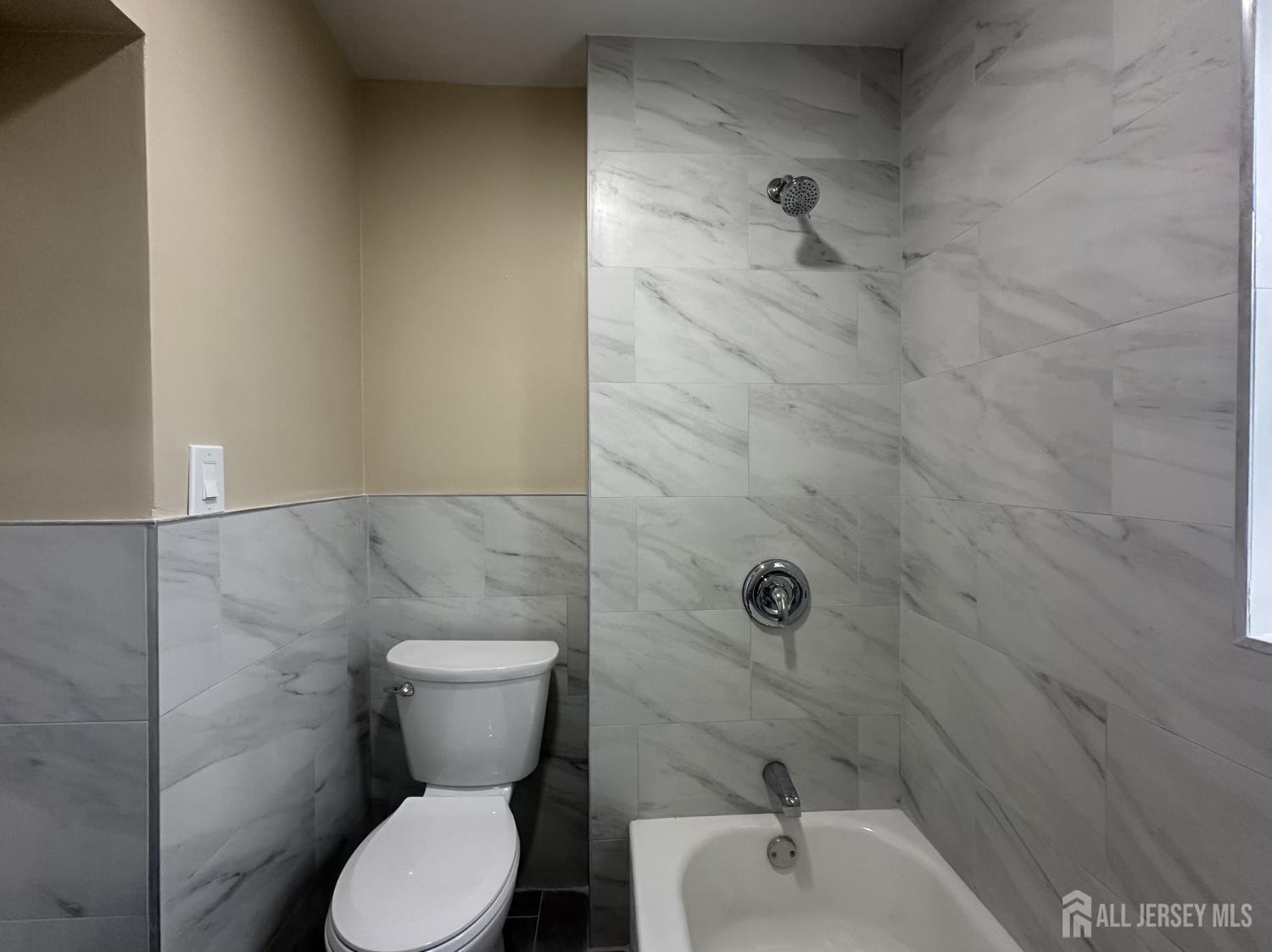 618 Carlock Avenue Perth Amboy, NJ 08861 - Photo 2 of 9 a bathroom with a toilet and a shower