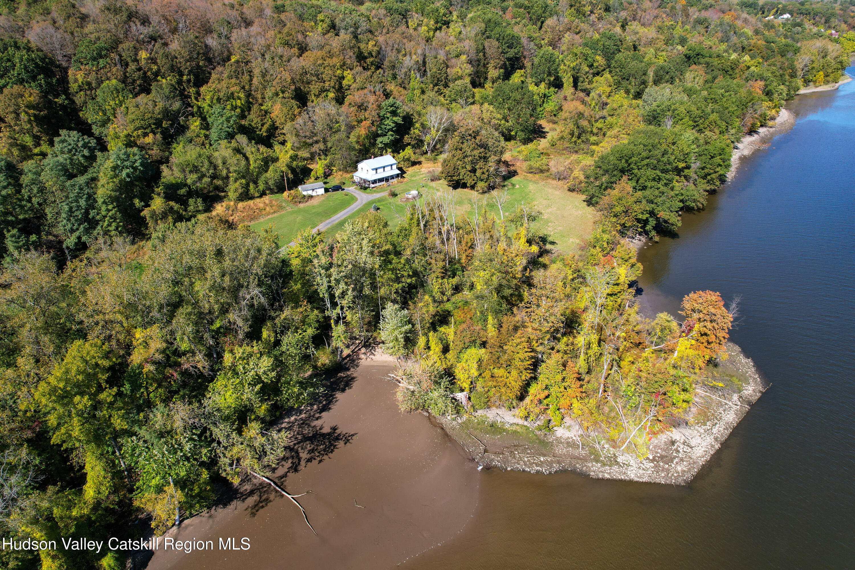 219-237 Swezey Road Coxsackie, NY 12051 - Photo 1 of 7 a view of a lake with a building